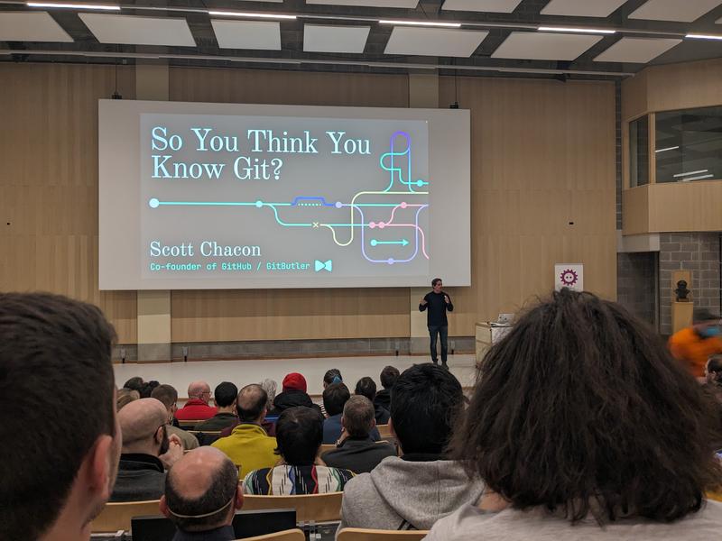 We're regularly attending conventions and conferences on IT subjects. Photo of a lecture hall at FOSDEM 2024