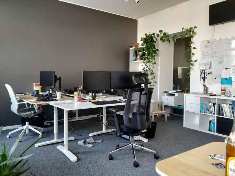 Yes, those are slippers under the desk Photograph of a part of our offices